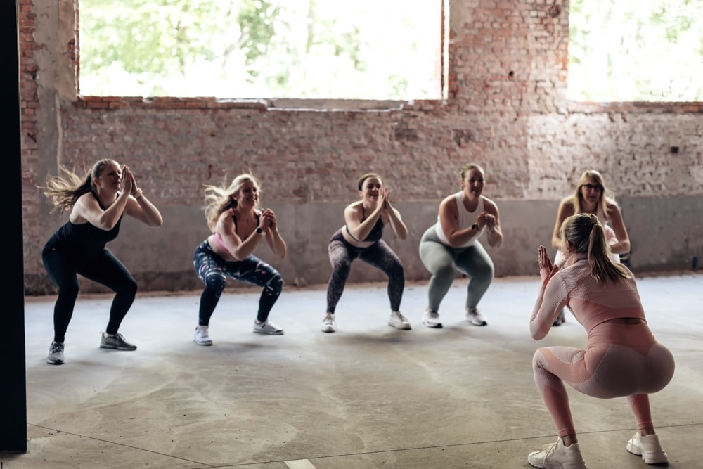 Group of women attending a weight loss activity in the gym