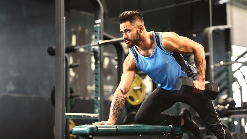 Muscular man working out in the gym