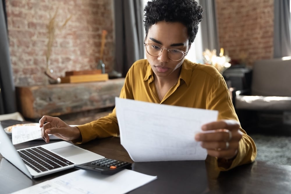 Woman in glasses preparing her taxes